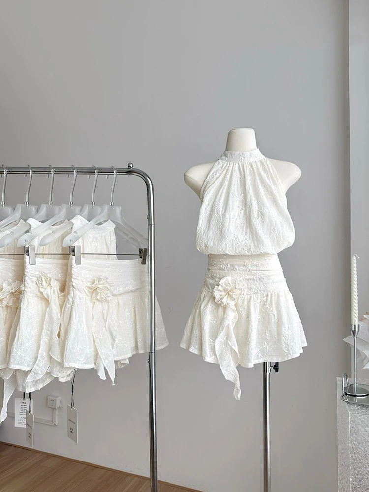 

Новый летний женский костюм с 3D-цветами камелии: свободный топ без рукавов с вышивкой, завязками и бантом, и юбка в корейском стиле. Повседневный комплект из 2 предметов.