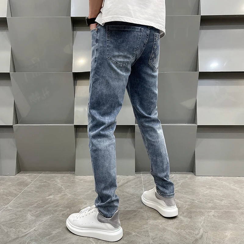 High-end light luxury printing men\'s jeans loose straight pants spring and summer models casual versatile light blue men\'s pants