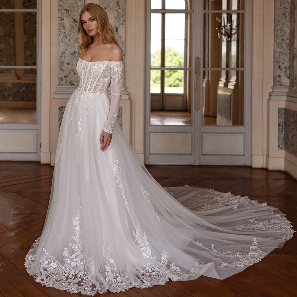 ชุดแต่งงานเจ้าสาวสุดหรู คอตัก แขนยาว ประดับลูกปัดและappliqué ชายกระโปรงทรงคอร์ท สายเดี่ยวเปิดหลัง ออกแบบได้ตามต้องการ