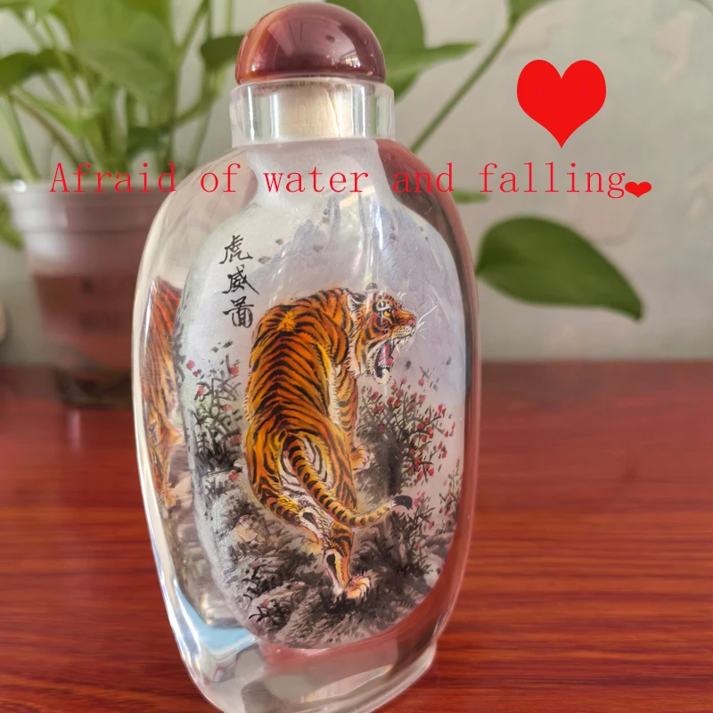 Chinese non cultural heritage snuff bottles, tigers pandas, handmade with a brush inside the bottle  Afraid of water and falling