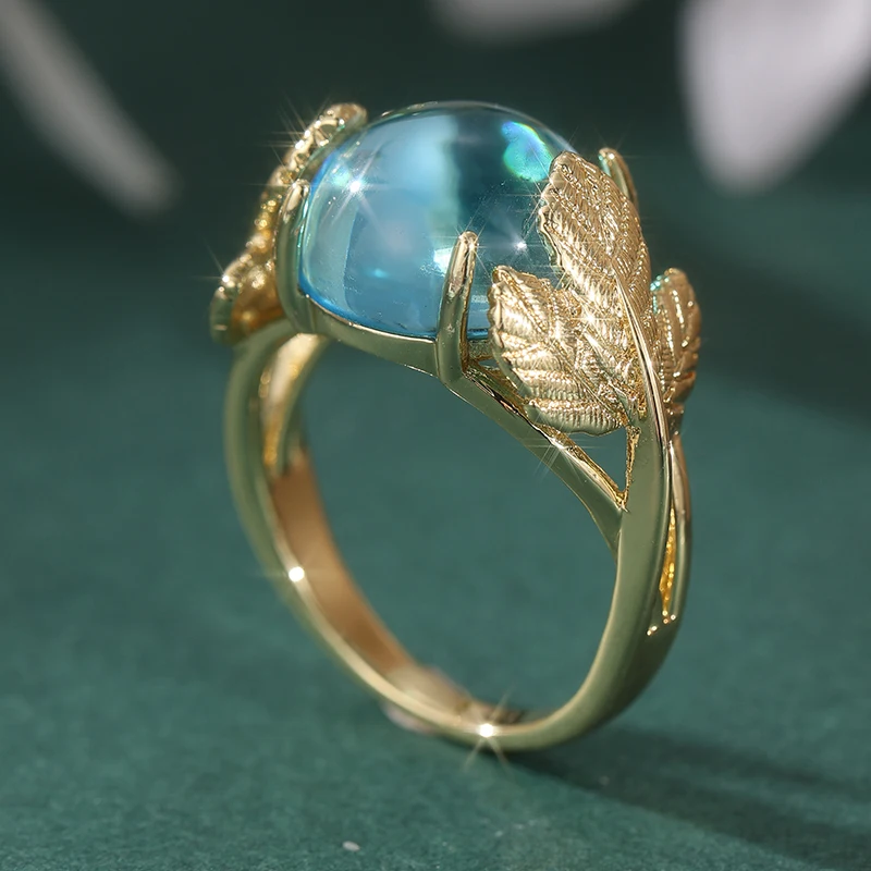Vintage-Ring für Damen in Goldfarbe mit eingelegtem meerblauen Stein, Blatt- und geometrischer Schnitzerei, für den täglichen Gebrauch, Partyschmuck – Detail 1