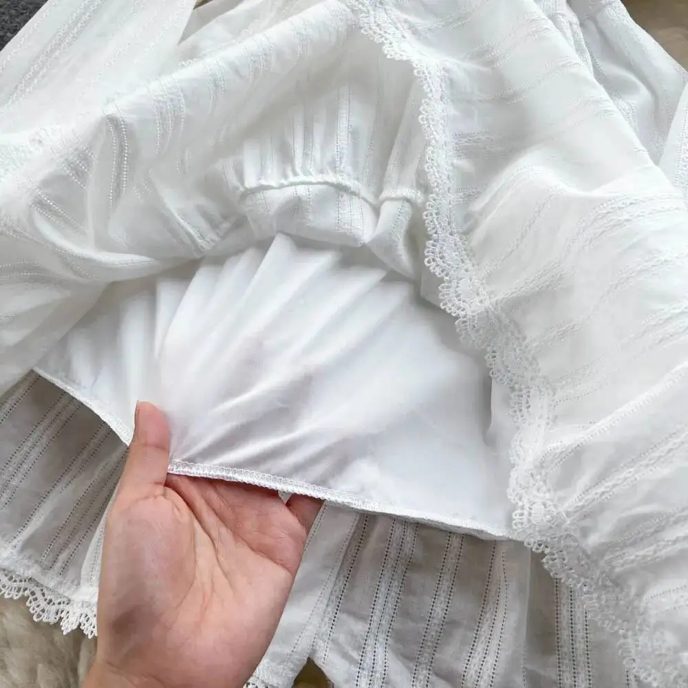 Abito da spiaggia bianco elegante da donna Primavera Autunno Abiti corti a vita alta vuoti in pizzo Abiti vintage Boho a maniche lunghe