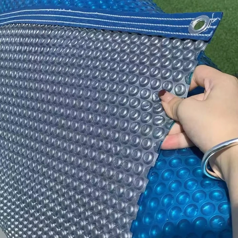 solar pool cover with a variety of bubbles, colors, and thicknesses enhances the pool's absorption of sunlight.
