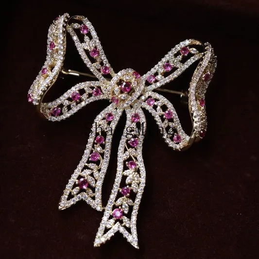 

CL niche high-end sense elegant bow brooch, retro temperament pin women's suit corsage tide