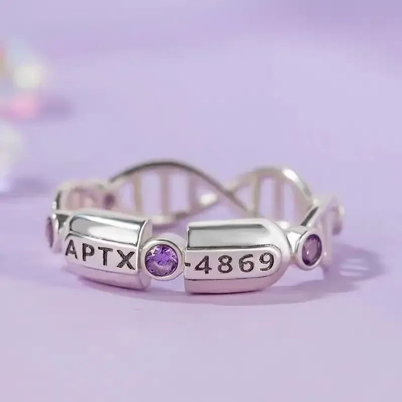 Detective Conan mismo estilo 4869 cápsula APTX tema nicho lindo anillo simple accesorios de anime regalos de vacaciones para hombres y mujeres