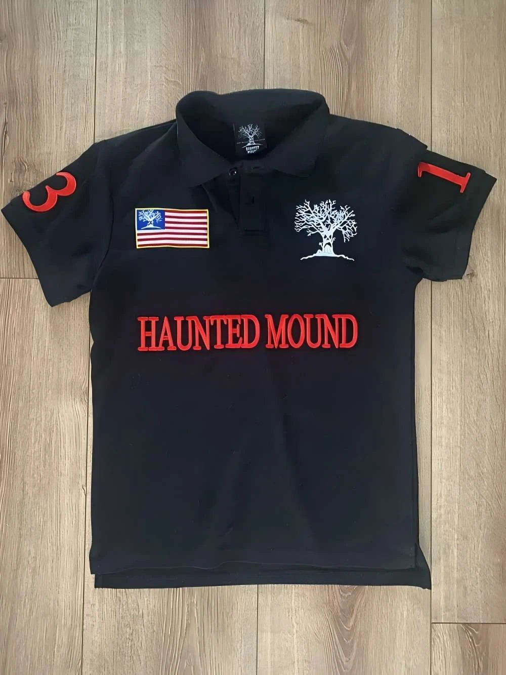 HAUNTED MOUND ポロシャツ 黒 Haunted Mound Men's Short Sleeve Polo Shirt Black/Red Multiple