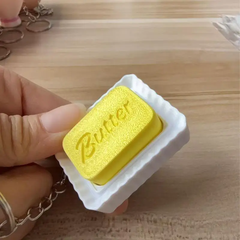 Niedlicher Butter-Slider-Schlüsselanhänger, simulierter Butter-Clicker, tragbares sensorisches Fidget-Spielzeug zur Angstlinderung, Taschenanhänger, Taschen-Ersatzteile – Detail 5