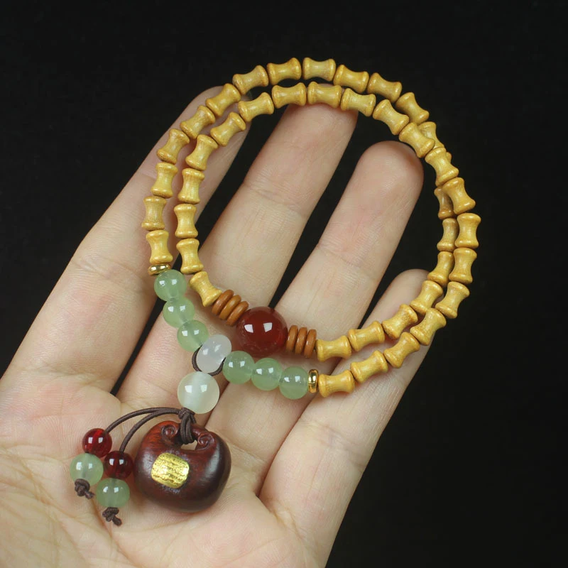 

Sandalwood bamboo knot double-ring Buddhist prayer beads, five-sutra money bag style, women's cultural accessory bracelet