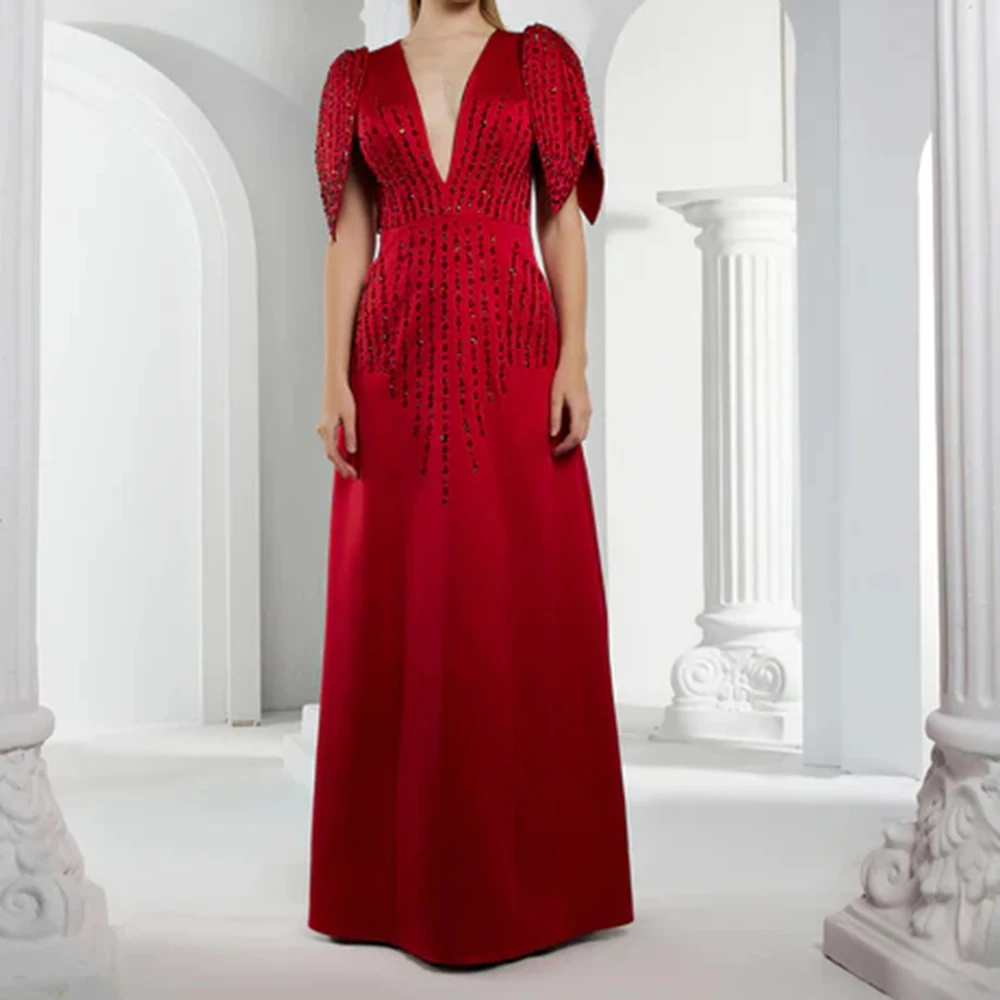 カスタマイズされた A ラインのイブニングドレス 足首までの長さの V ネック ノースリーブ プロムドレス ファッション スパンコール付き シンプル ドレープ 絶妙なパーティードレス