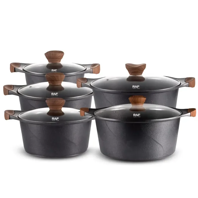 Non-stick kitchen utensils set includes pots and pans with lids, black/white cookware set.