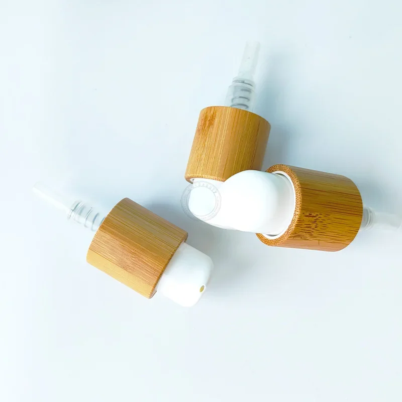 

high quality Eco-friendly Bamboo Press Bottle Caps Lids With White Plastic Nozzle Emulsion Lotion Pump Used for Cosmética Bottle
