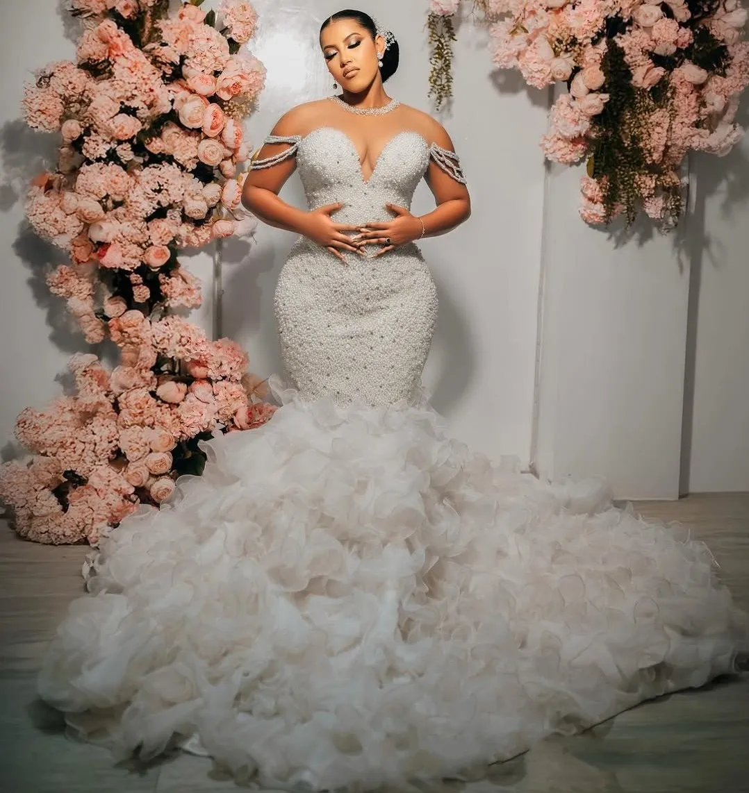 

Elegant African Wedding Dress Bridal Gowns For Bride Mermaid Sheer Neck Illusion Long Sleeves Beaded Lace Pearls Tiered Vestidos