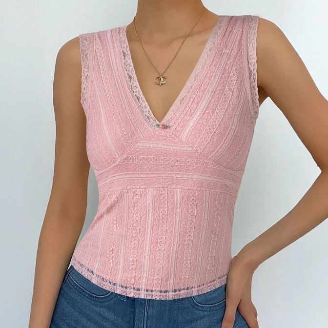 

A flower vest and a V-neck, slim pink top make for a must-have ensemble for the sweet and spicy fashionista, exuding style and p