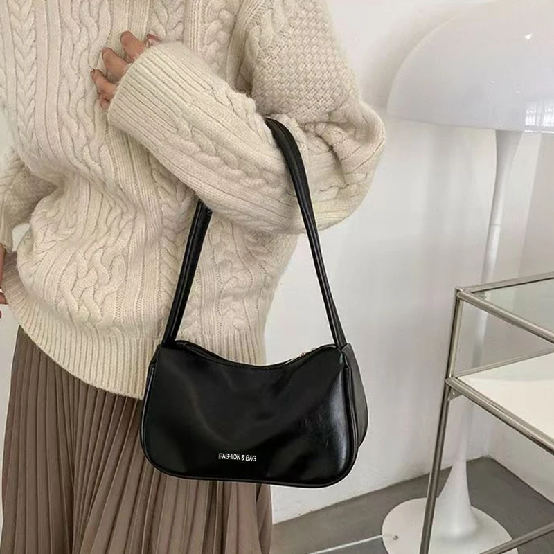 The lady's small bag is suitable for travel and photography. It has a single-layer zipper and features small letter designs.