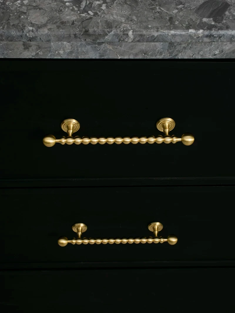 Beaded cabinet handle in brushed brass shown in the supplier product illustration 22