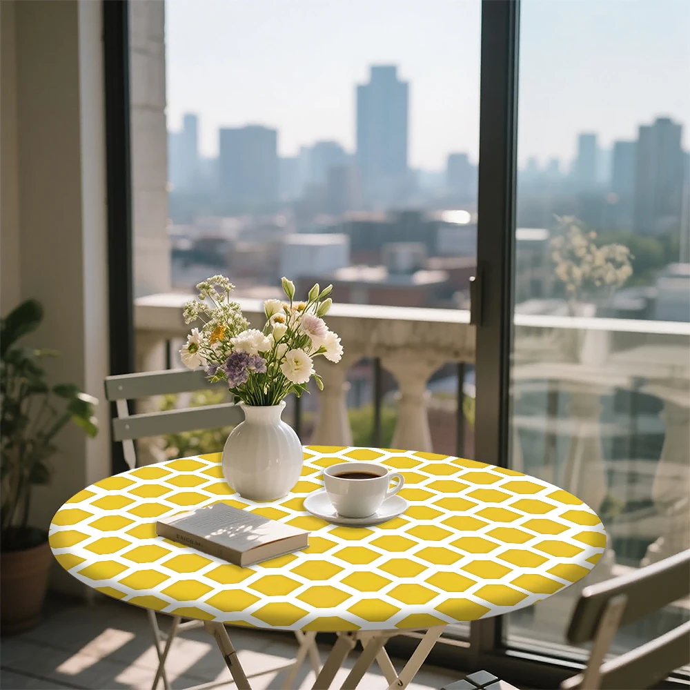 The round elastic tablecloth features a yellow and white hexagonal pattern. Made of polyester, it's suitable for indoor dining r