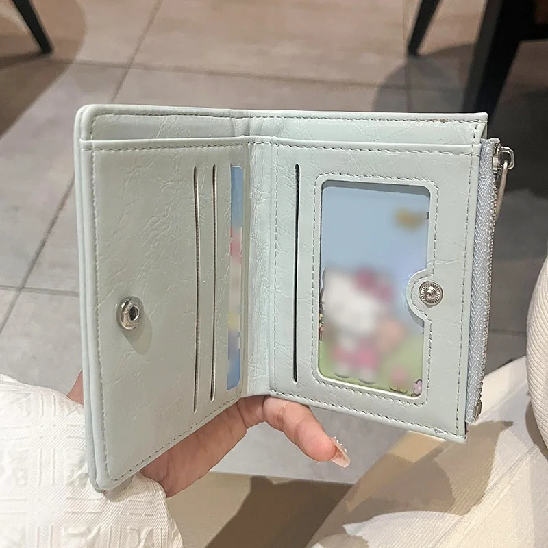 Crinkled PU bi-fold wallet, metal accent, multi-slots with ID window, side zip coin slot, stylish portable for ladies.