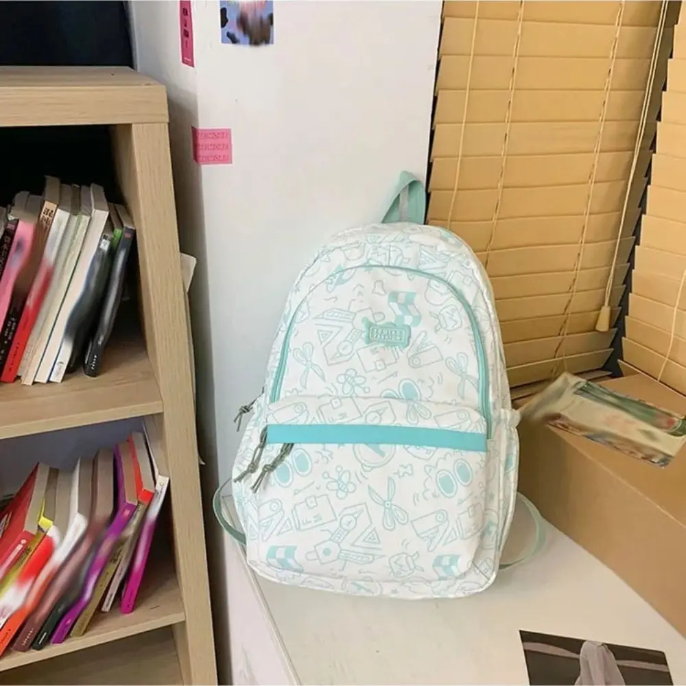 سعة كبيرة أزياء الطلاب على ظهره الكتابة على الجدران خربش حقيبة مدرسية الترفيه حقيبة كتف عادية بنين بنات