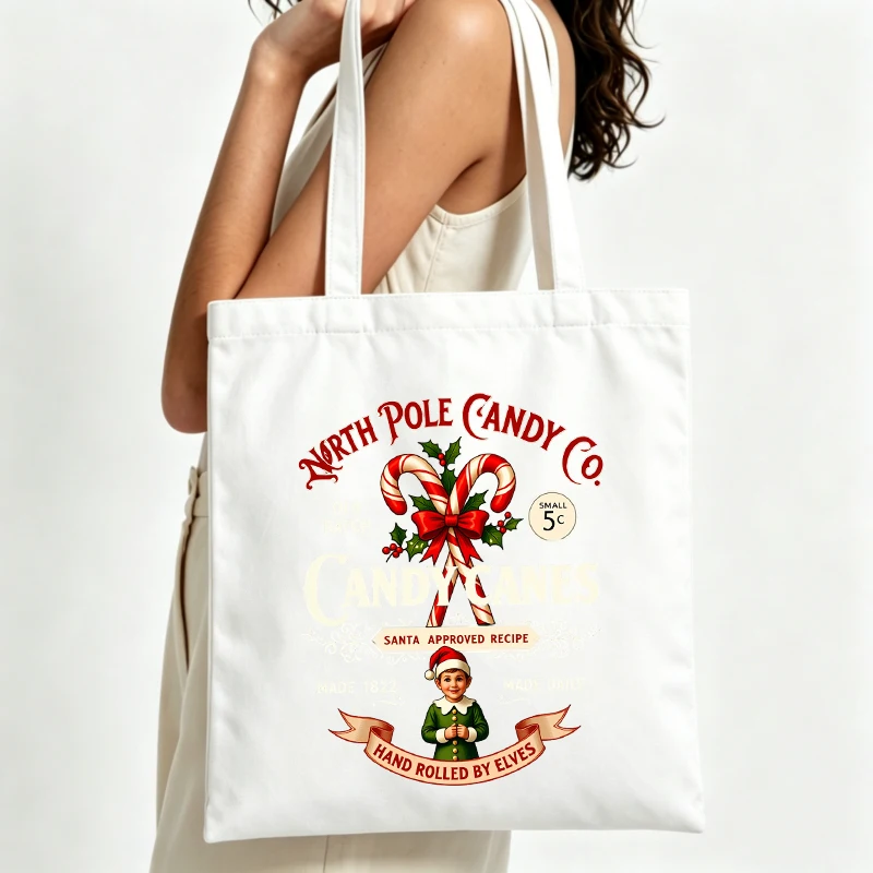 Women's candy cane graphic canvas tote bag with vintage holiday design, perfect for Christmas shopping and seasonal outings