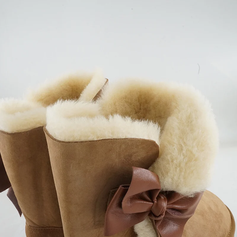 Moda laço botas de neve de pele natural novos sapatos femininos pele de carneiro genuína pele real 100% lã inverno meados de bezerro botas de neve