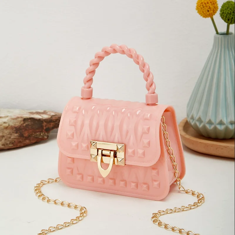 Nouvelle chaîne de verrouillage PVC Portable Mini sac de gelée Rivet une épaule bandoulière rouge à lèvres petit sac sacs pour femmes sacs à main