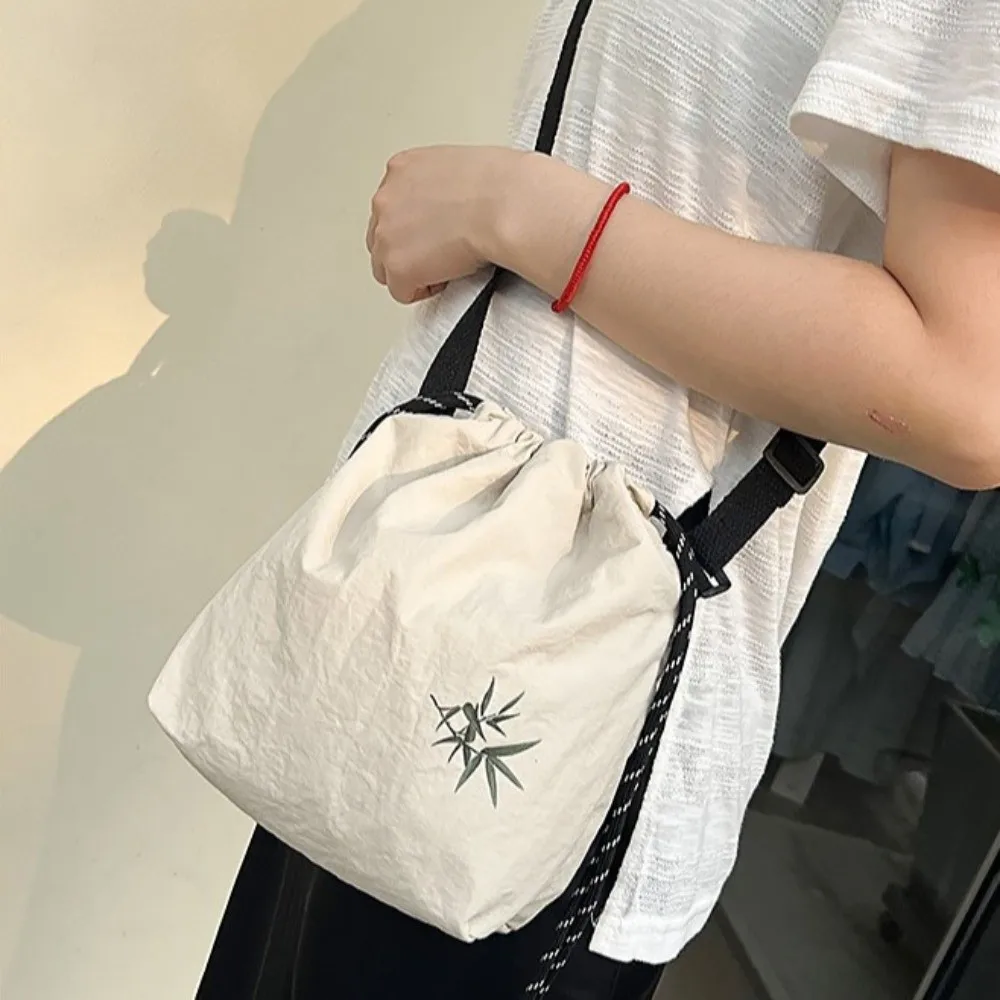 

Adjustable Drawstring Shoulder Bag Large Capacity Korean Style Nylon Bucket Bag Solid Color Lightweight Crossbody Bag Daily