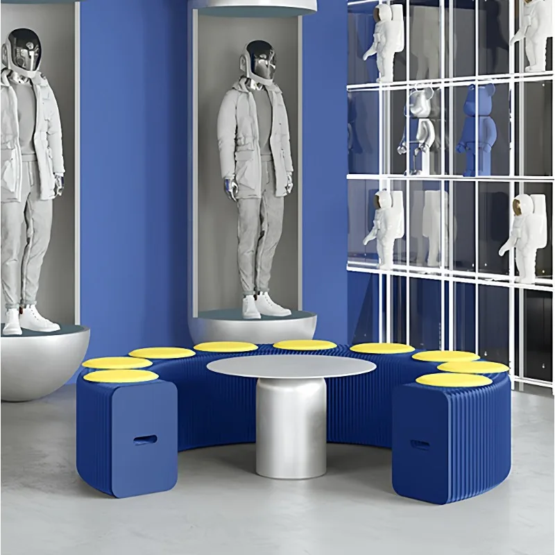 Pink paper folding bench multi-seat stool queuing waiting for a pop-up store creative fashion exhibition event