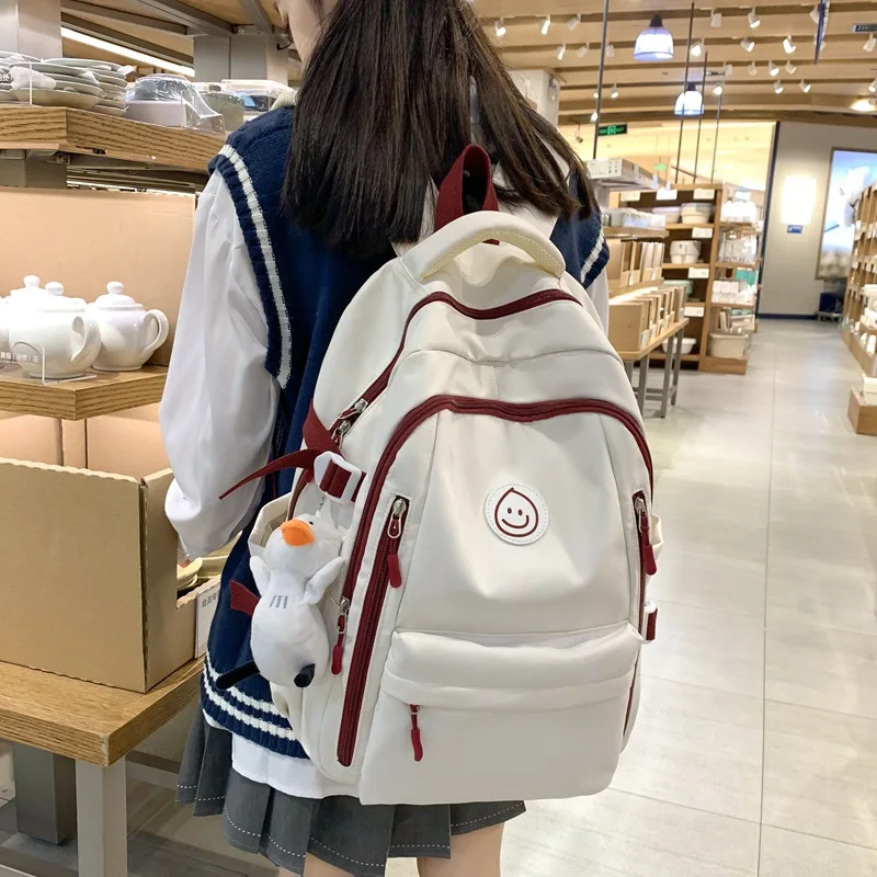 2024 new version of minority solid color backpack autumn new high school students large capacity multi-pocket schoolbag female