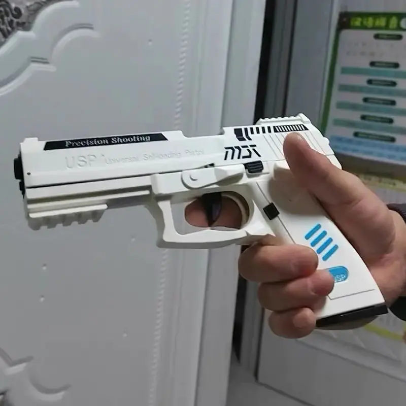 Pistola giocattolo USP Fuoco continuo con guscio da lancio laser Pistola sospesa vuota Lanciatore di giochi all'aperto Regalo di Natale per ragazzi