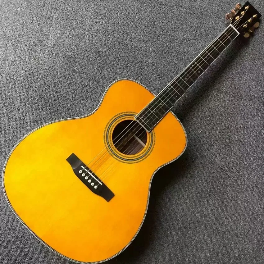 The 40 inch OM28 series is a solid wood profile with yellow glossy paint acoustic acoustic guitar