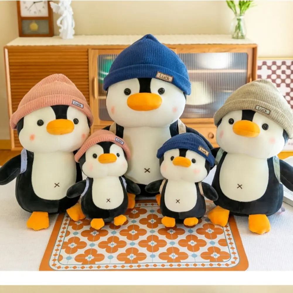帽子をかぶっているペンギンバックパックリトルペンギン人形快適睡眠コンパニオンぬいぐるみスロー枕ぬいぐるみぬいぐるみ