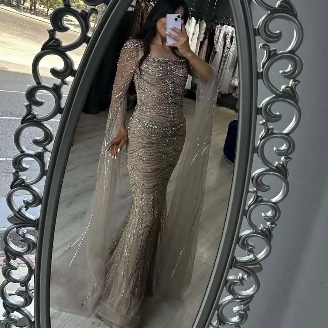 ROSEINTHEBOX Abito da sera a sirena con perline personalizzato Arabia Saudita 2025 Maniche a mantella Dubai Abito da ballo di lusso per occasioni formali