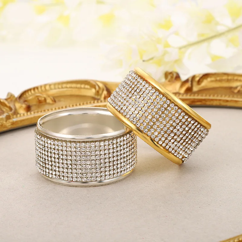 Hotel napkins decorated with diamond encrusted napkins rings, model rooms, dining tables, tables, napkins, clasps