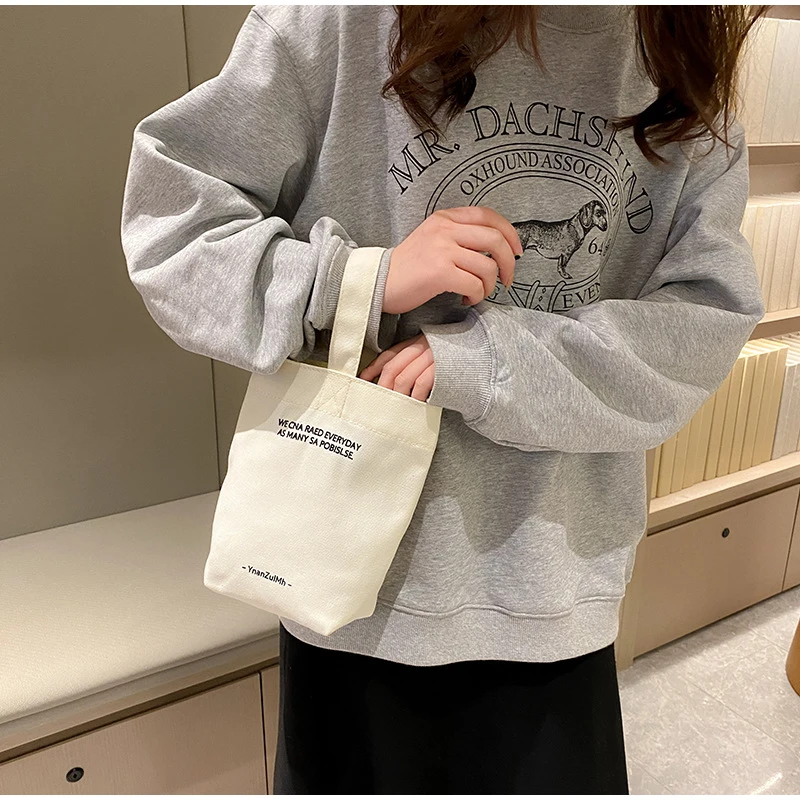 

Women Canvas Small Square Bag Solidcolor Mini Handbag Leisure Water Bottle Bag Cylindrical Soft Shoulder Messenger Bag Lunch Bag