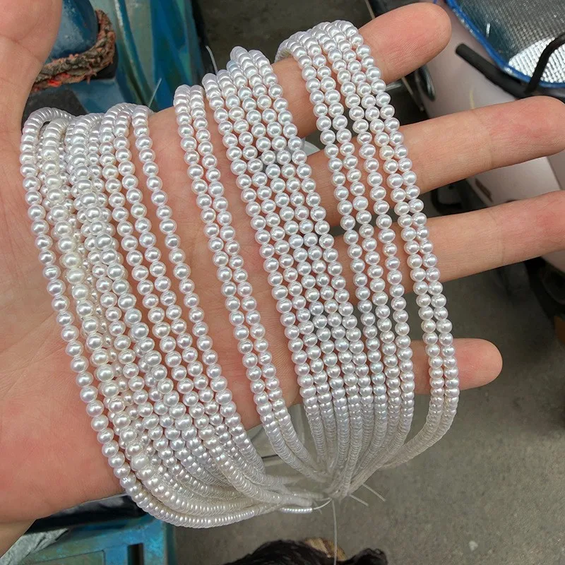 A strand of nearly round natural freshwater pearls, 3-3.5mm in size, measuring 39-40cm in length, with approximately 120 beads.