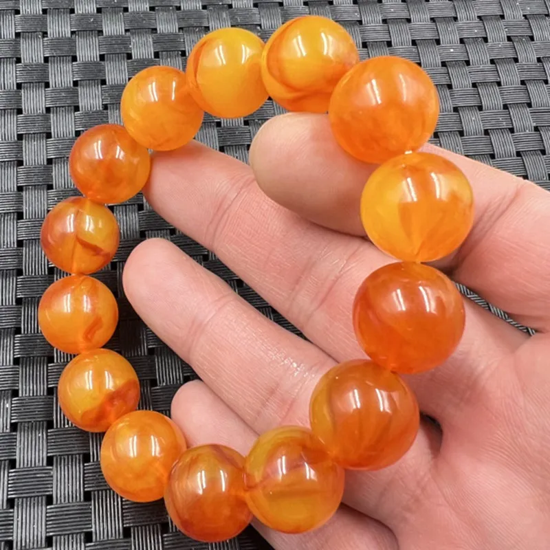 Fluorescent floating saltwater round bead , orange-red second-generation old amber bracelet, unisex couple's brace