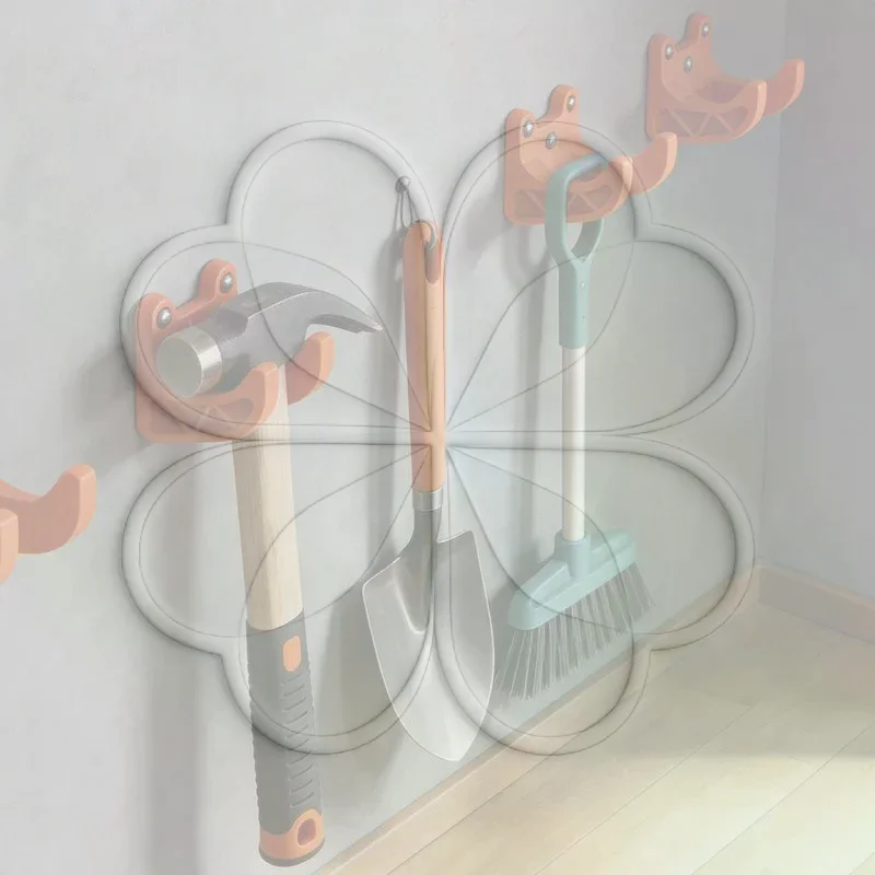 Wall-mounted tool rack for long-handled tools (such as brooms, shovels, and rakes), made of durable plastic