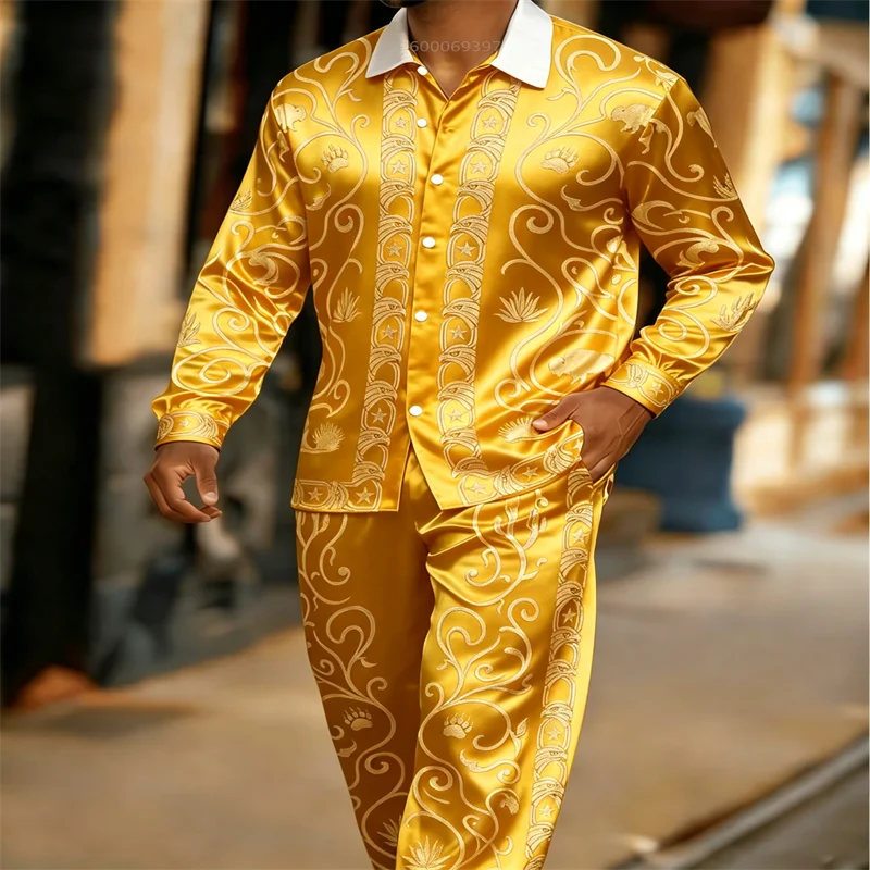 This men's luxury satin two-piece set features a gold-printed long-sleeved shirt and trousers, perfect for parties and weddings.