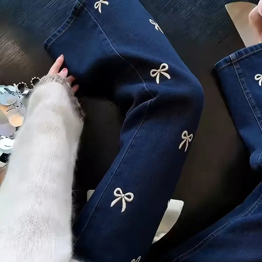 Bow embroidered micro-pull jeans 2026 new slim-fitting and thin casual versatile lazy nine-point pants elastic waist