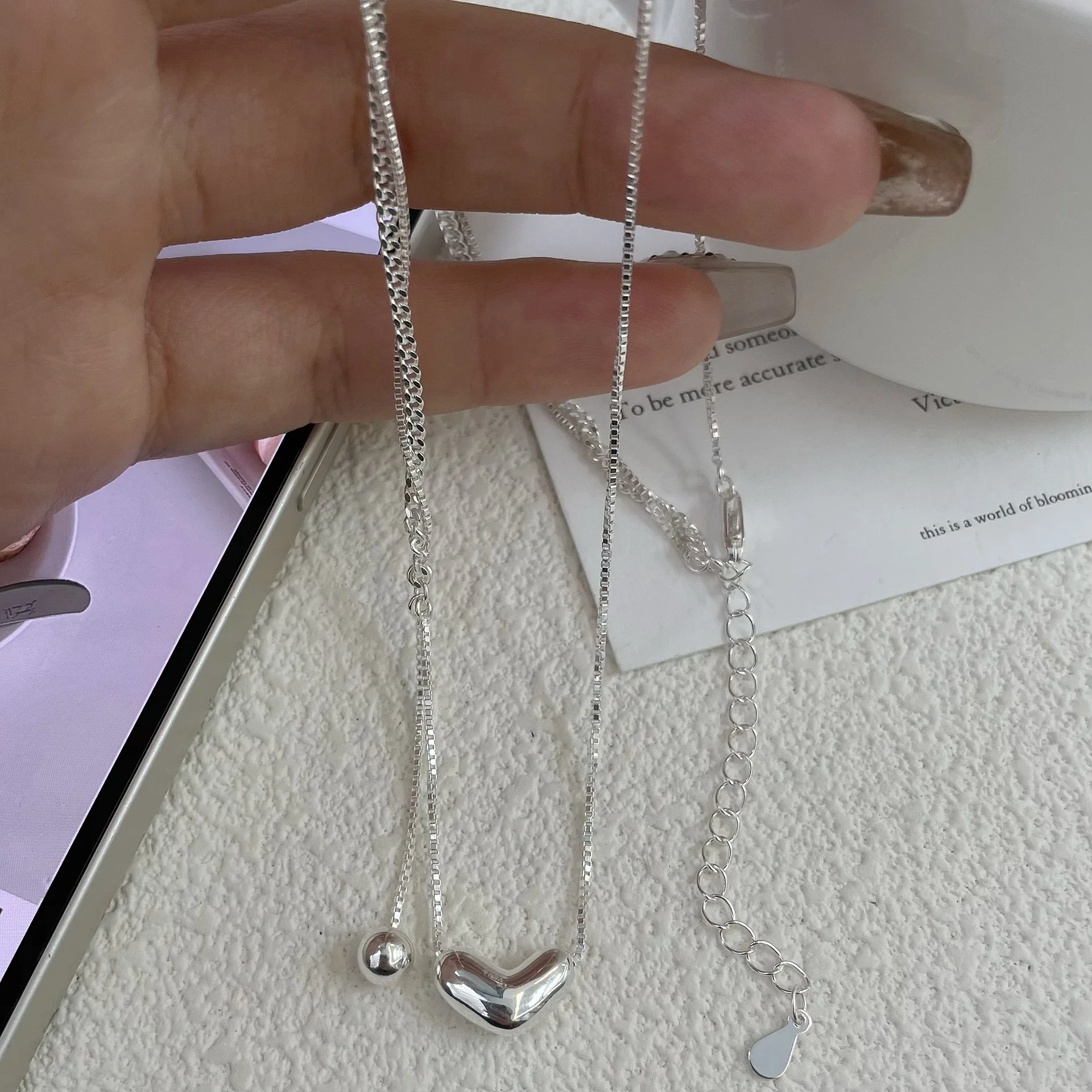 

Ins temperament versatile, simple and high-end S925 pure silver three-dimensional heart-shaped tassel collarbone necklace
