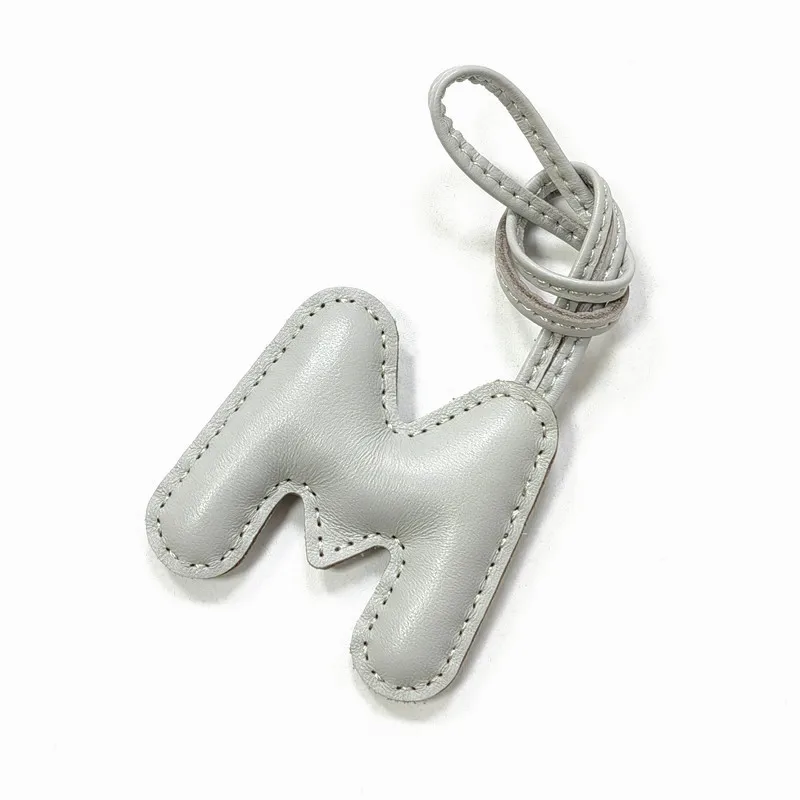 Genuine leather M, letter style decoration, hand sewn, high-end car keychain accessories