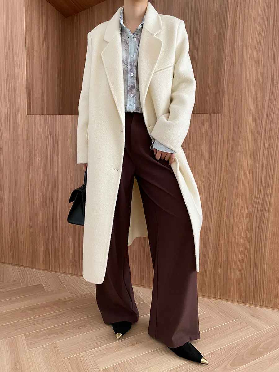 Winter women\'s casual solid color lapel long sleeved pocket decoration loose long coat