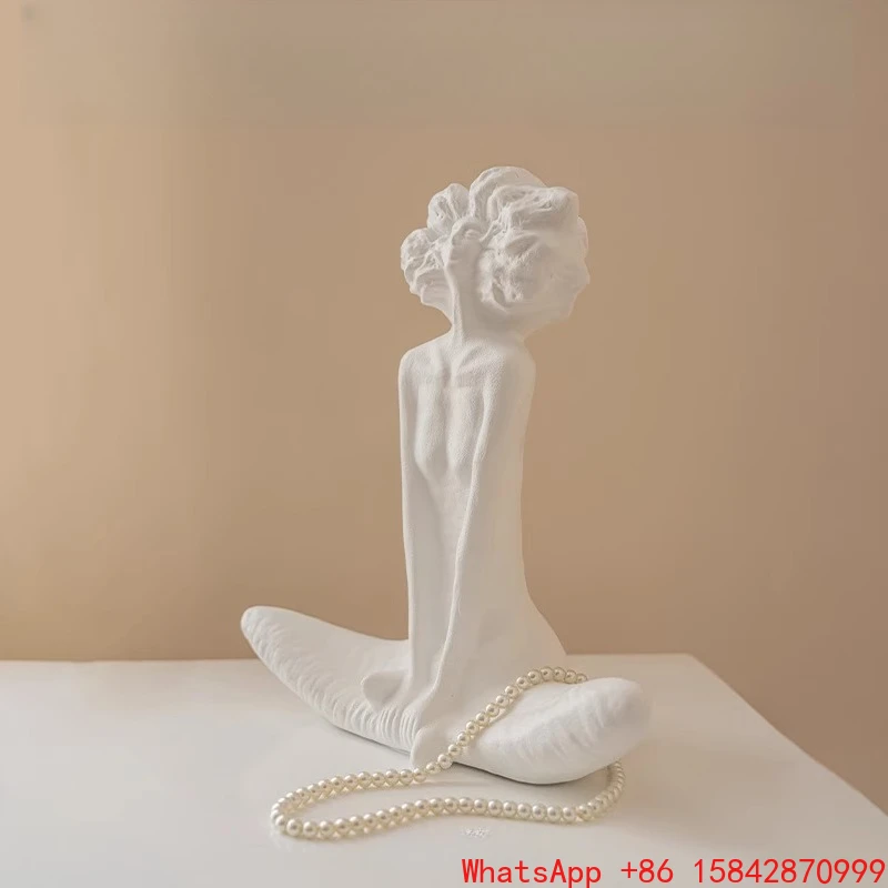 

Ivory white figure sculpture tabletop ornament