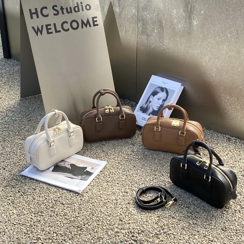 

Baiyun wholesale new light luxury leather baguette women's bag cowhide niche high-end bowling handbag pillow bag