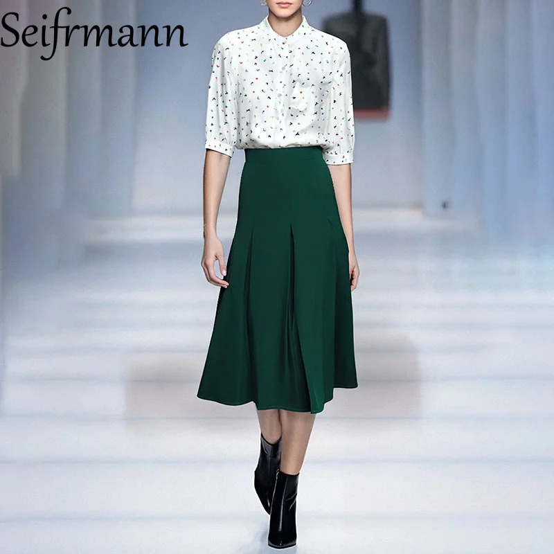 

Seifrmann 2025 г. модный и элегантный топ с воротником-стойкой и рукавами семь четвертей в сочетании с плиссированной юбкой с высокой талией