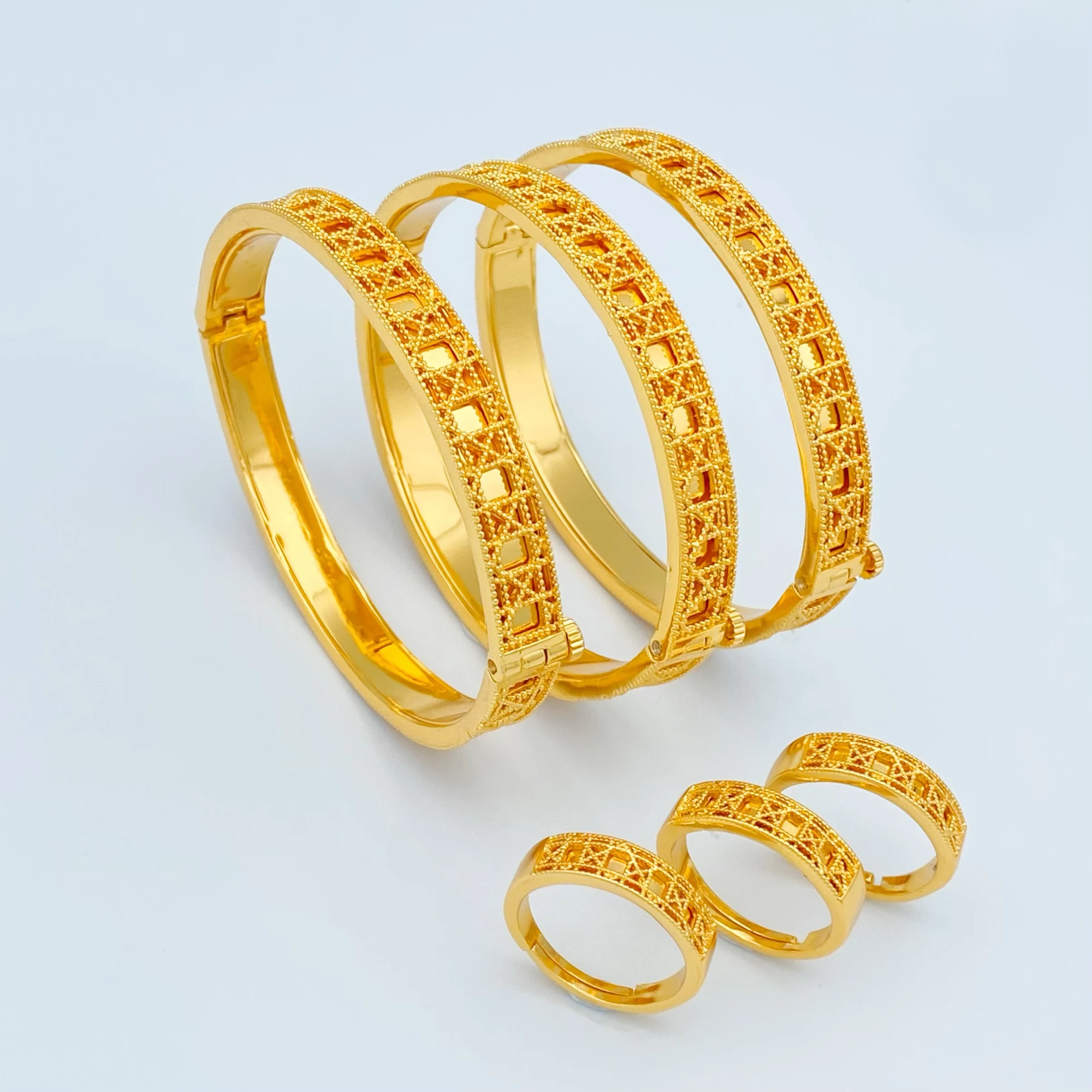 

Exquisite Gold - Plated Hollow Jewelry Set: Bangles and Rings, Unique Design for Women, Ideal Gift Choice