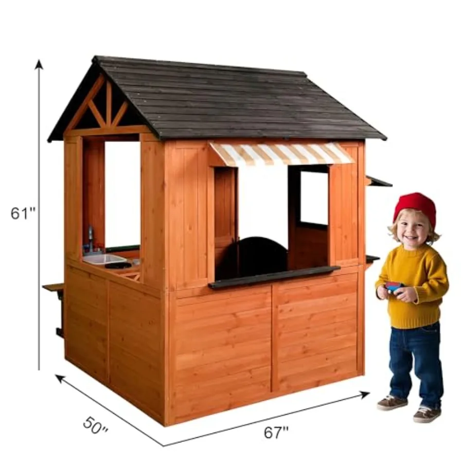 Outdoor backyard kids playhouse made of cedar wood with working door and windows, featuring toy sink, stove, side serving stati