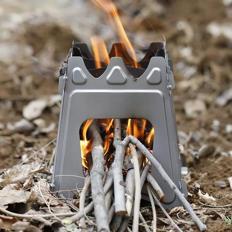 

Range rover outdoor portable wood stove ultra-light outdoor camping fire wind-proof picnic card stove home barbecue.