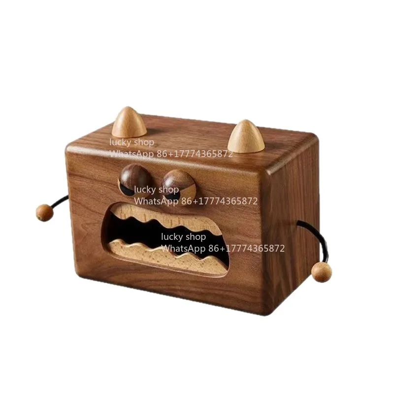 The Little Monster-shaped Solid Wood Tissue Box Is A Small Object That Is Both Interesting and Practical.
