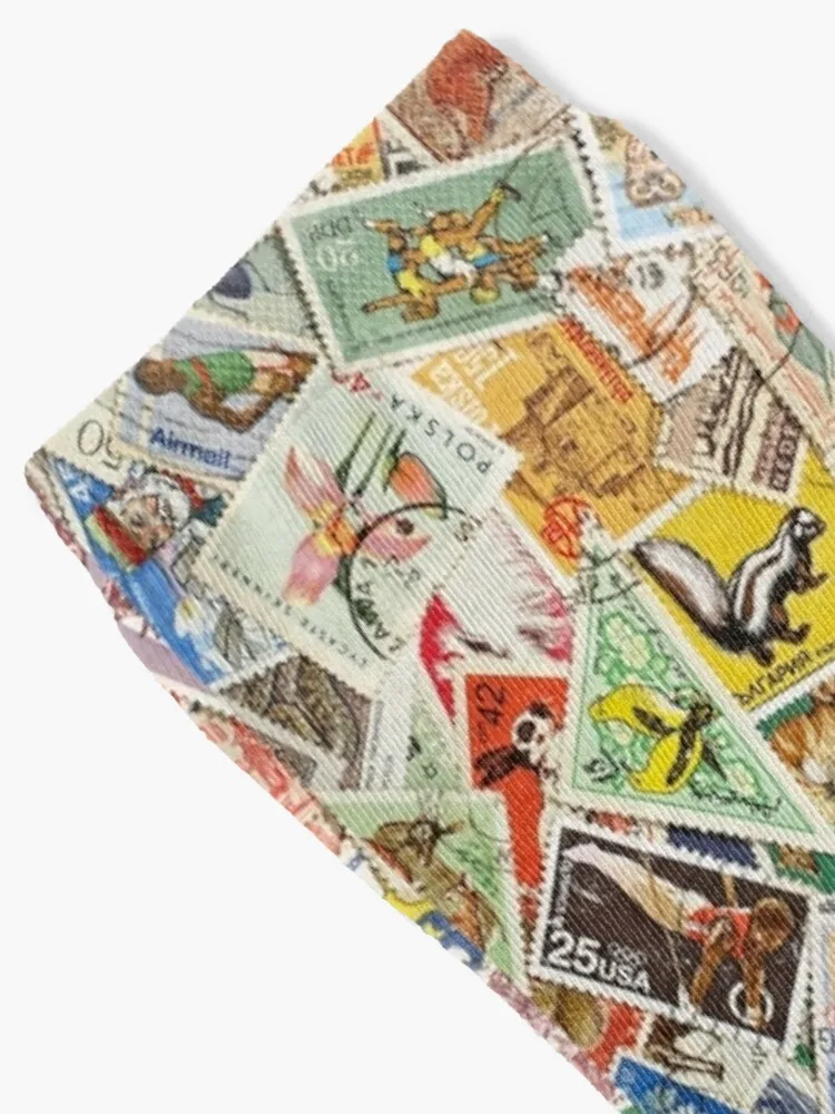 Postage stamps of different countries as background. Socks